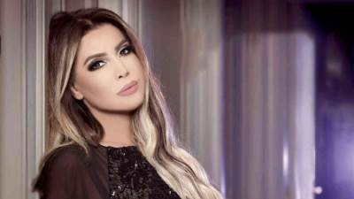 نوال الزغبي تتألق بفستان أسود جرئ